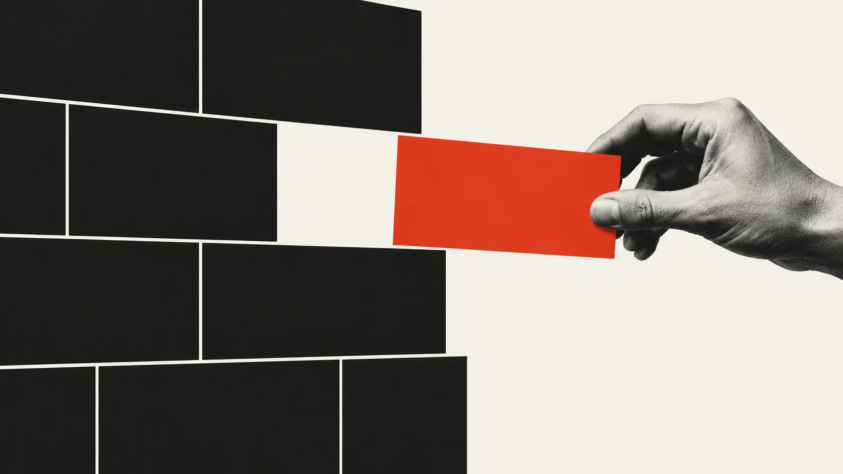 A hand places a red rectangular block into a gap in a black brick wall.